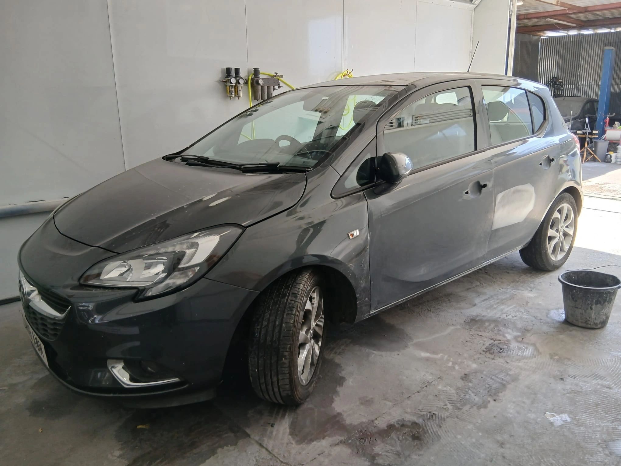 Car with a custom two-tone wrap finish and red trim detailing
