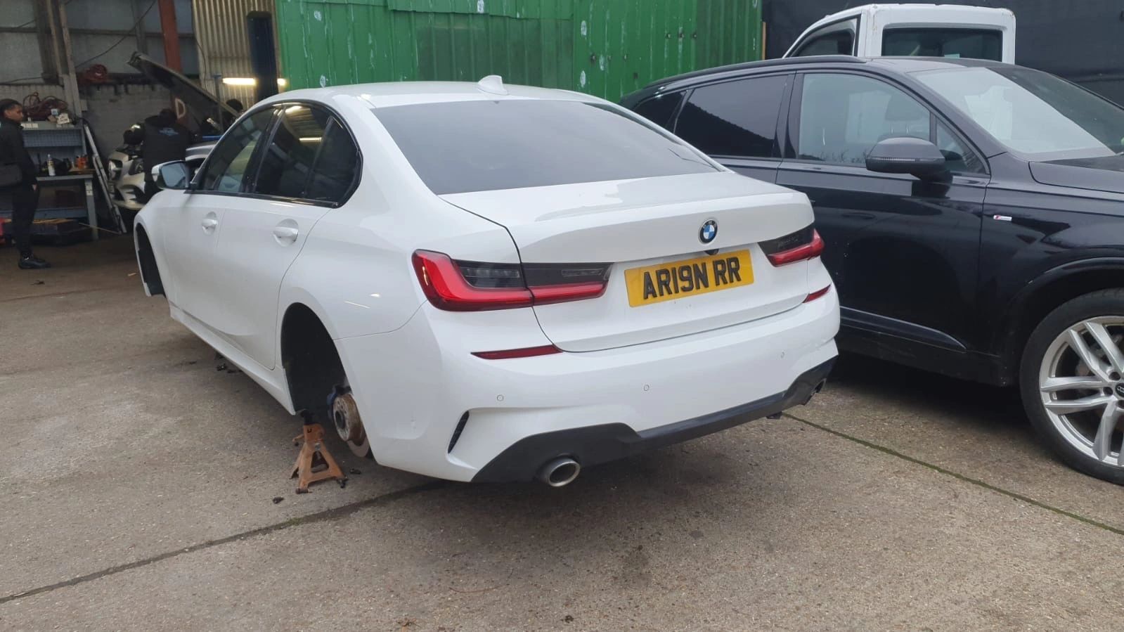 Car raised on stands during mechanical work