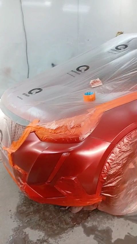 Car front in a red matte finish