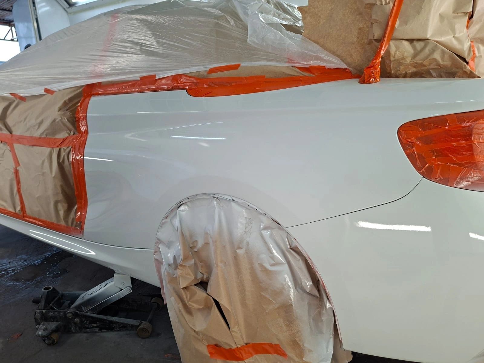 White BMW masked along the side